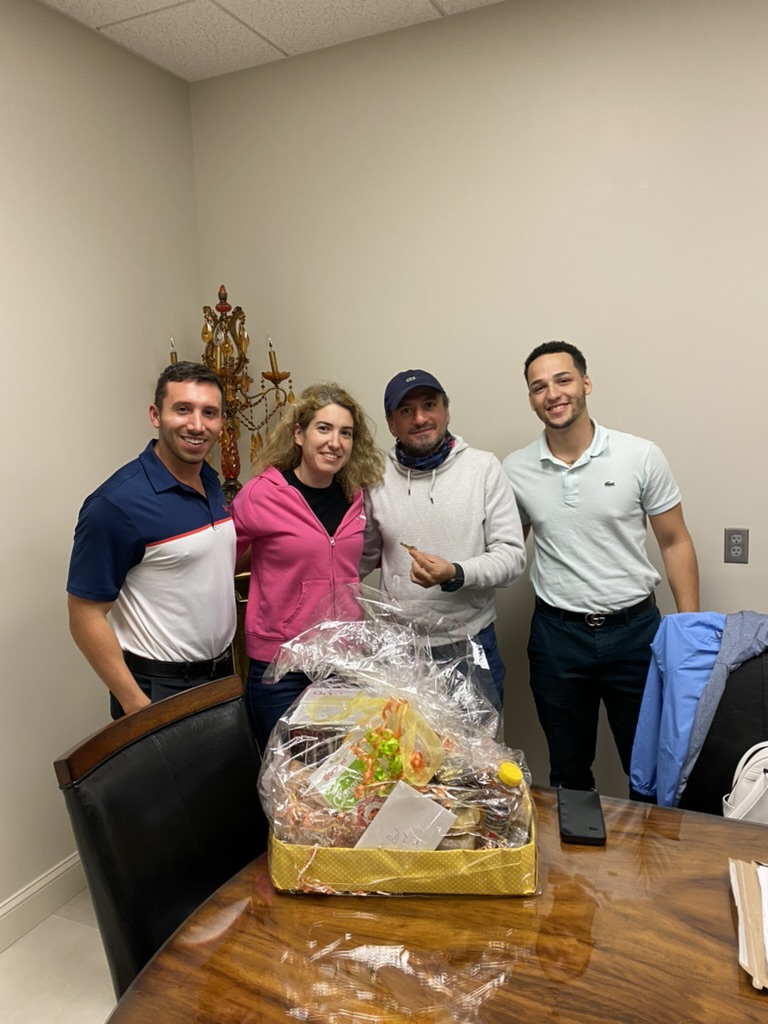 Tony Ubaldini with clients on closing day